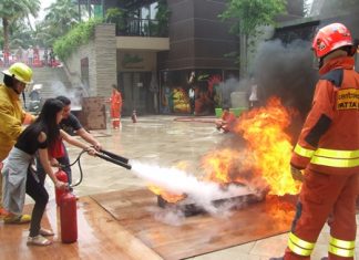 Workers at Central Festival Pattaya Beach are given training and a chance to practice putting out fires.
